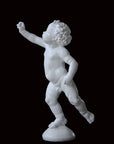 Photo of a sculpture of a cherub on a black background