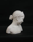 A photo of a sculpture of a Florentine girl on a black background  