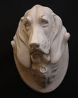 photo of a sculpture of a dog head on a black background 