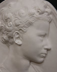 Photo of a sculpture of a little girl on a black background