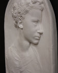 Photo of a sculpture of a little girl on a black background