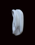 photo of cast sculpture drawing of left ear from Michelangelo's David statue against a black background