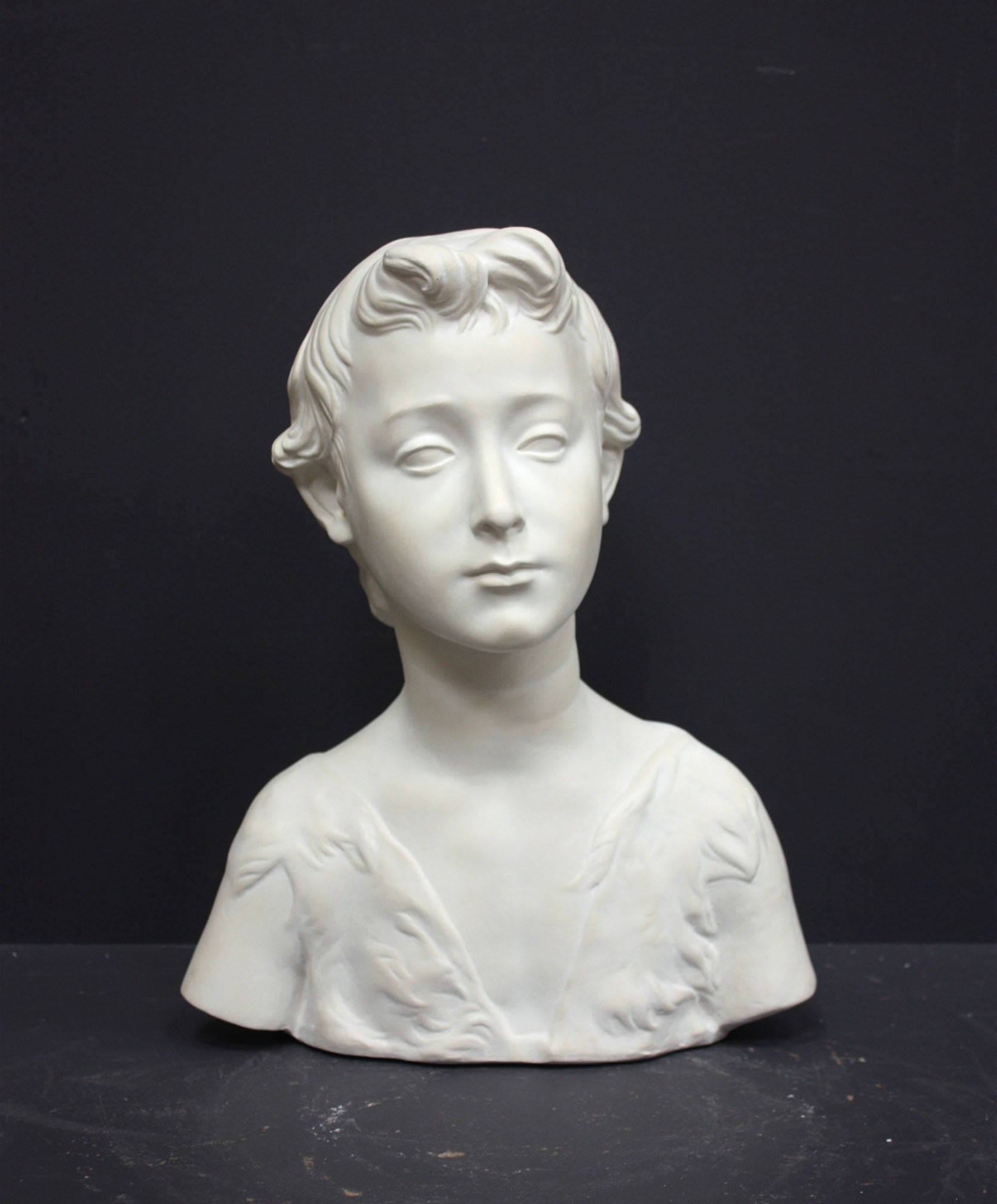 Photo of s sculpture of st john on a grey background 