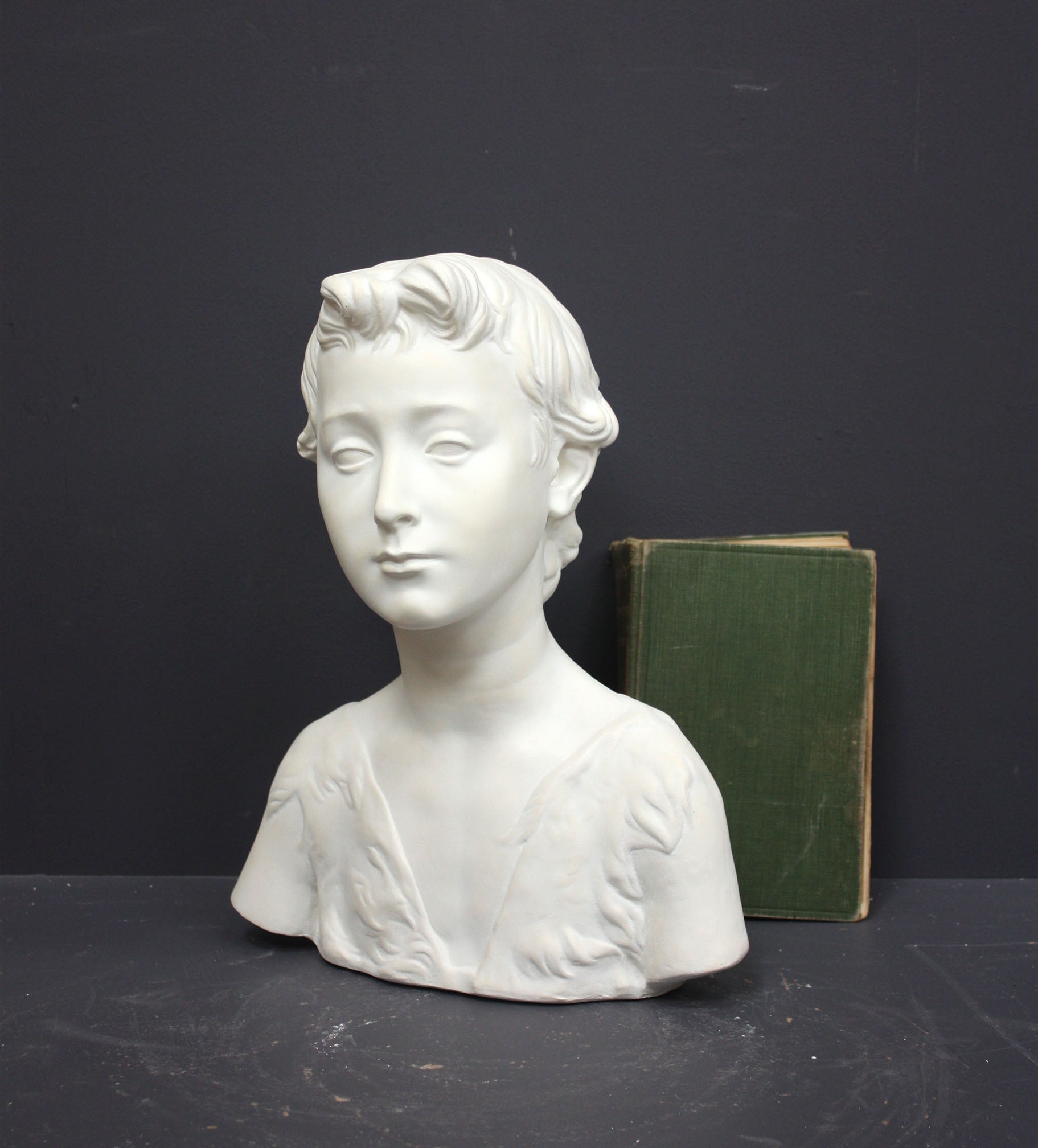 Photo of s sculpture of st john on a grey background 