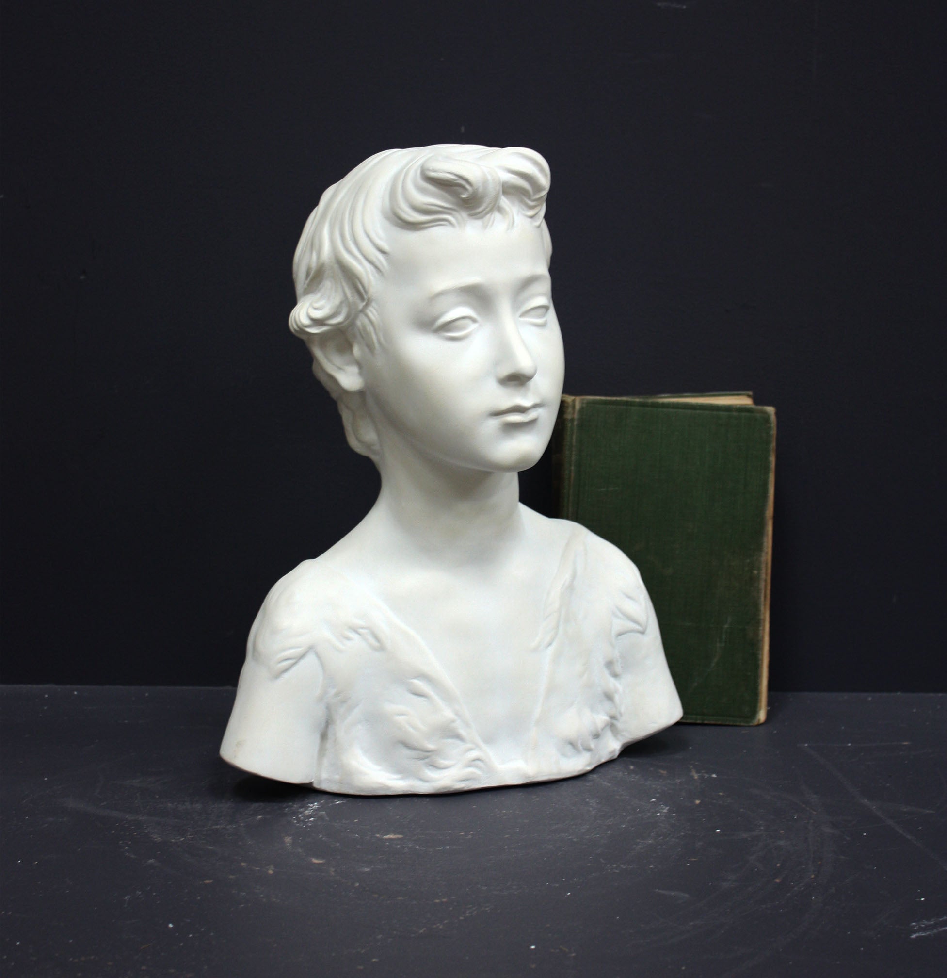 Photo of s sculpture of st john on a grey background 