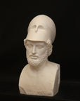 Photo of male sculpture with beard and helmet on a black background