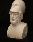 Photo of male sculpture with beard and helmet on a black background