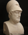 Photo of male sculpture with beard and helmet on a black background