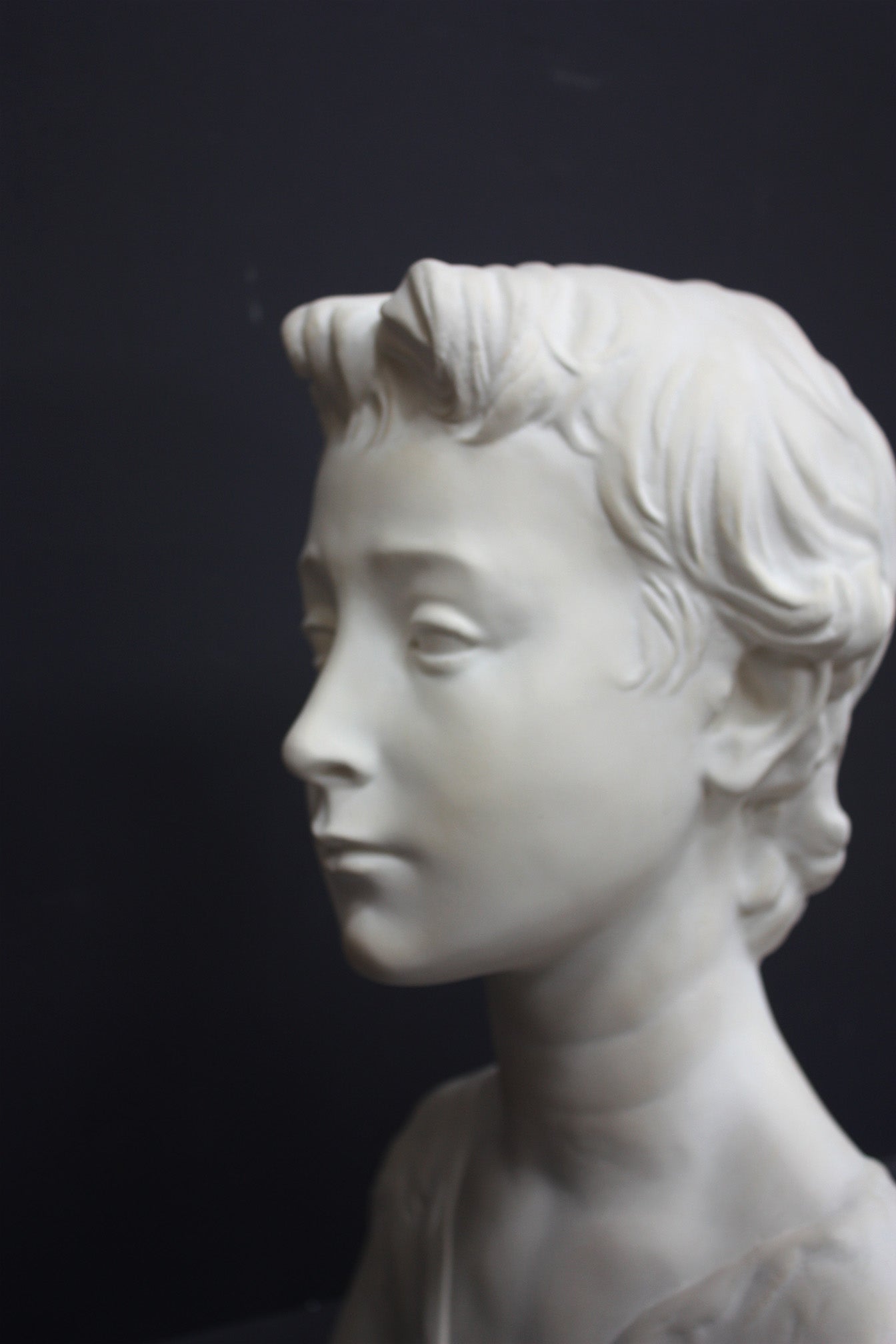 Photo of s sculpture of st john on a grey background 