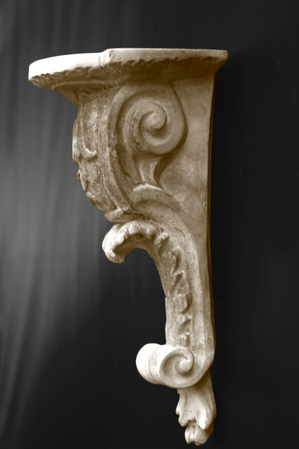 image of a plaster statue of a renaissance bracket on a gray background