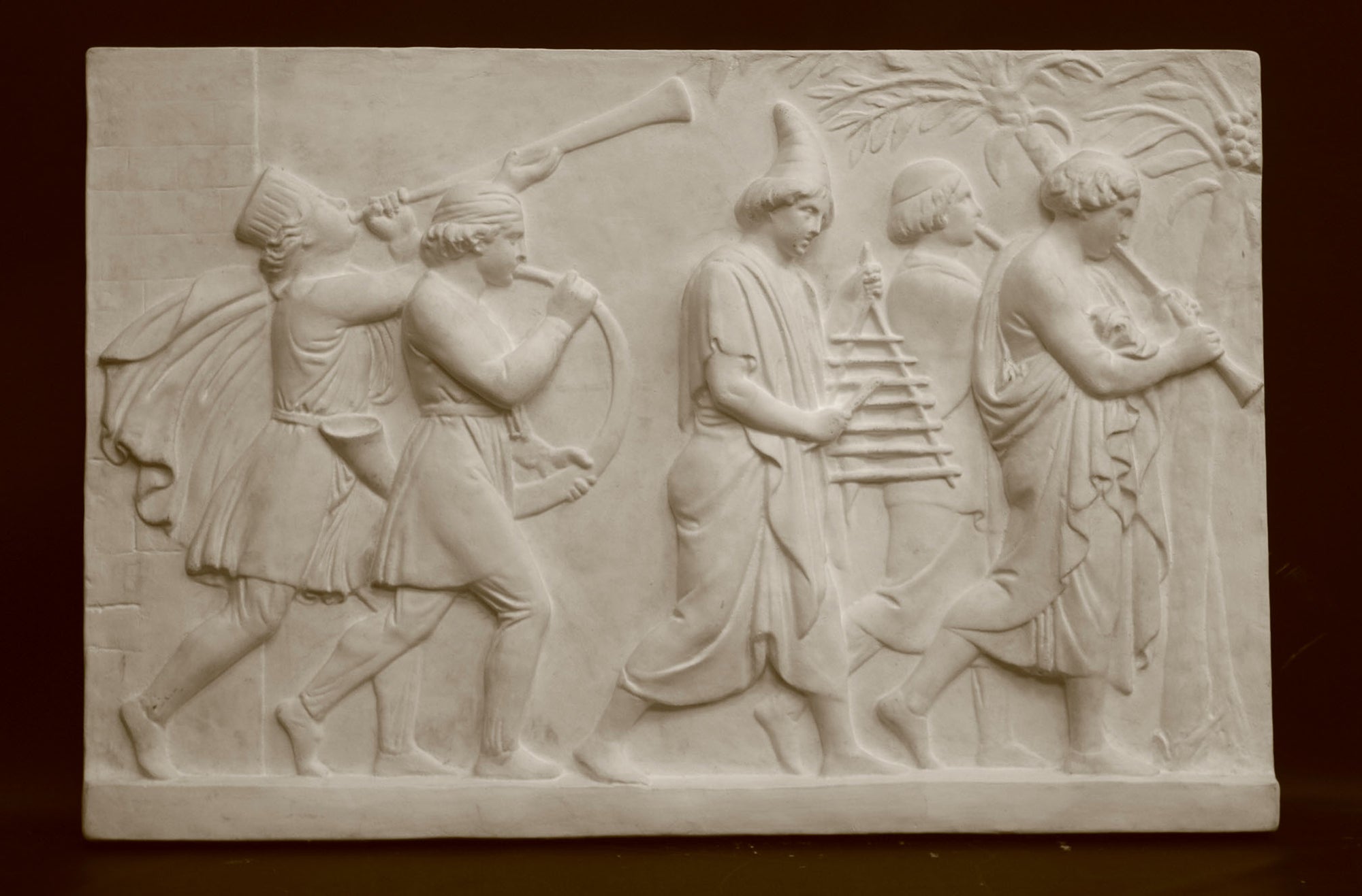 Photo of a sculpture of a marching band on a black background