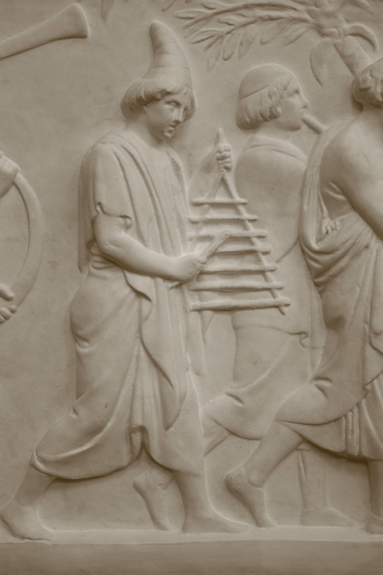 Photo of a sculpture of a marching band on a black background
