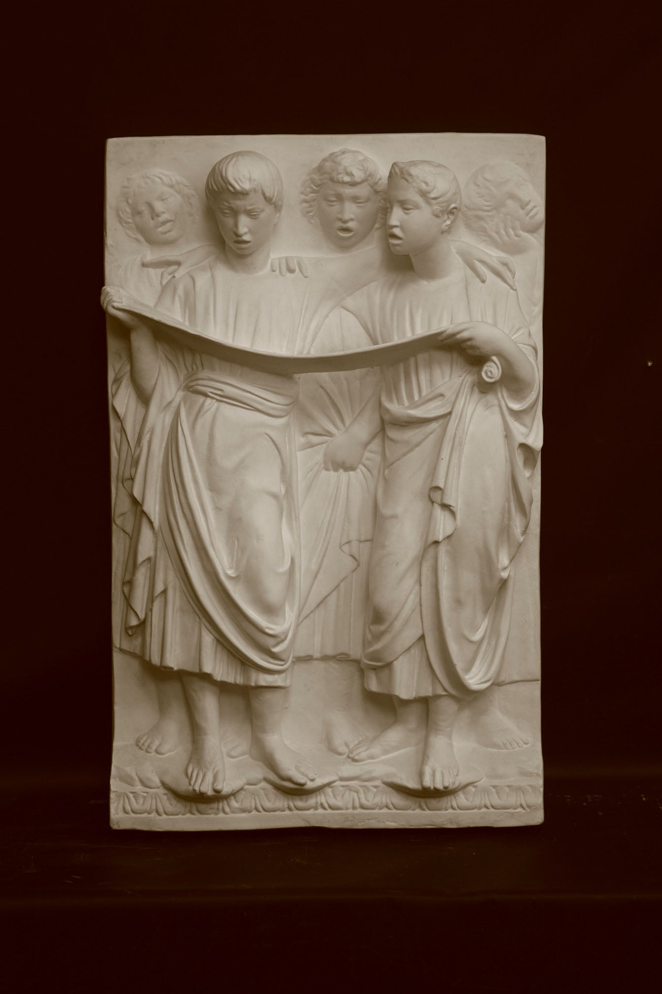 Photo of a sculpture of Cantoria Singers on a black background