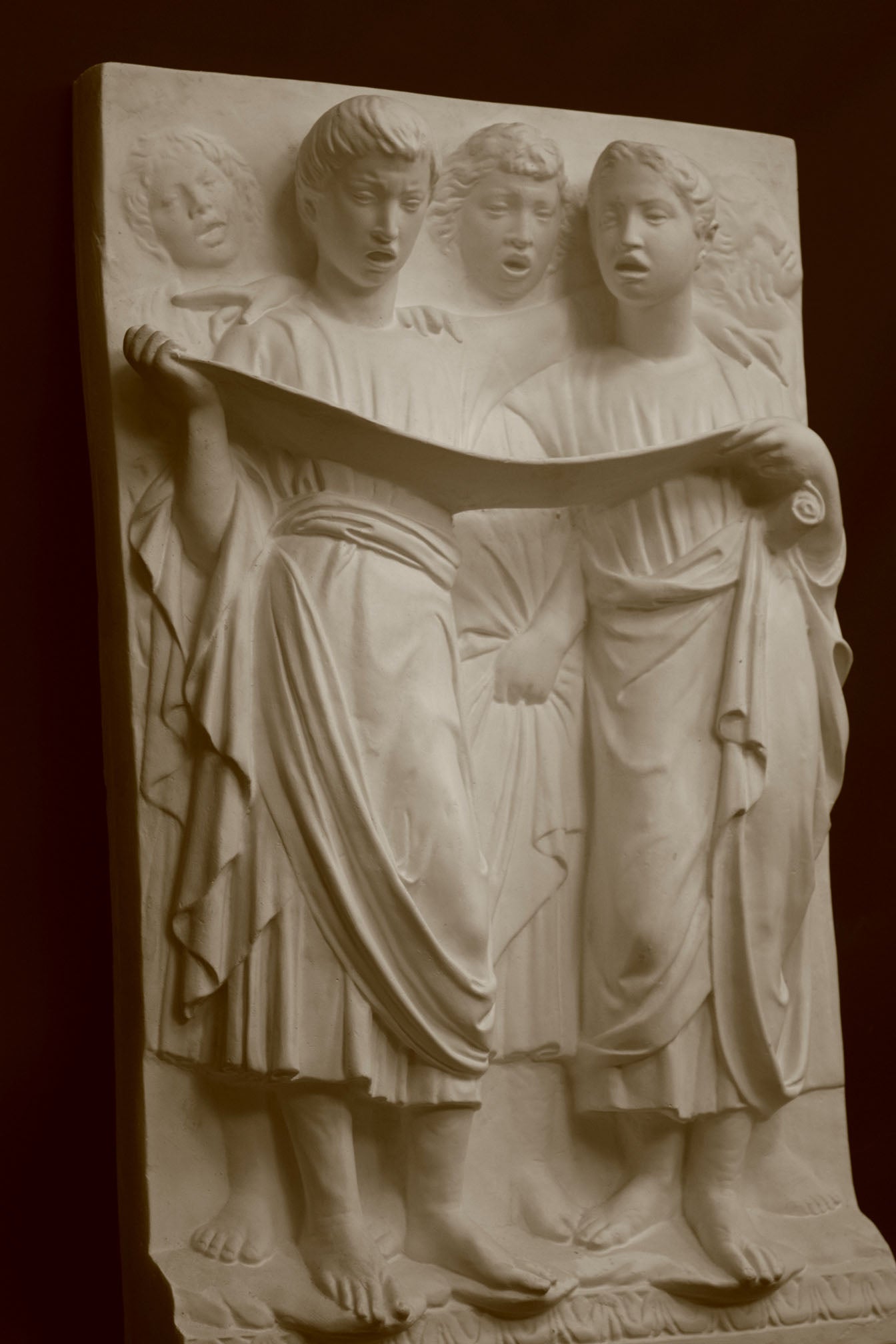 Photo of a sculpture of Cantoria Singers on a black background
