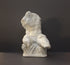 image of a plaster sculpture of nude male torso on a gray background