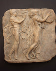 Photo of sculpture of 2 figures marching with musical instruments on a black background
 