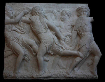 photo of plaster cast relief of children dancing with black background