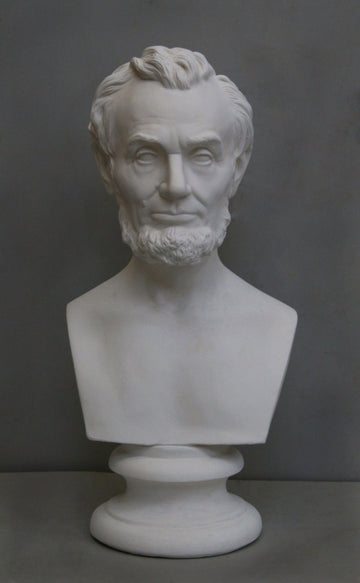 photo with gray background of plaster cast bust sculpture of man with beard, namely Lincoln