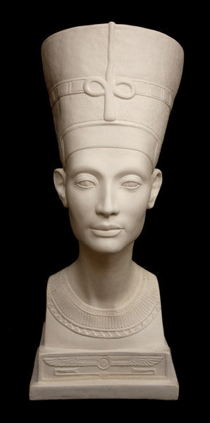 photo of plaster cast sculpture of bust of Nefertiti with crown and decorative collar on a decorative base with a black background