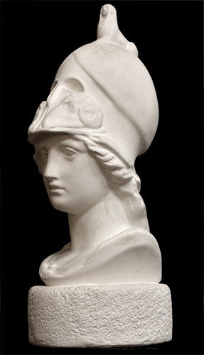 photo of plaster cast sculpture bust of female head, namely the goddess Athena, with a helmet on a black background