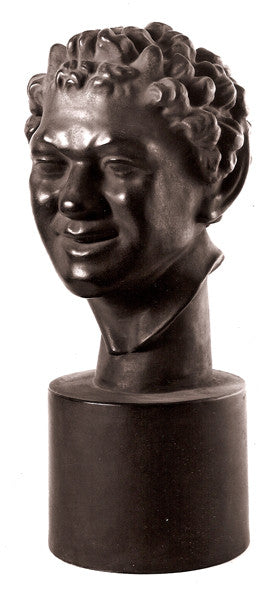 Photo of plaster cast sculpture of faux bronze faun head 