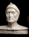 photo of plaster cast bust sculpture of Dante Alighieri with cap and high-necked robe with red book leaning against right side on black background