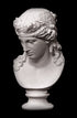 photo of plaster cast of sculpture bust of Ariadne or Bacchus with long, curly hair and head band on a black background