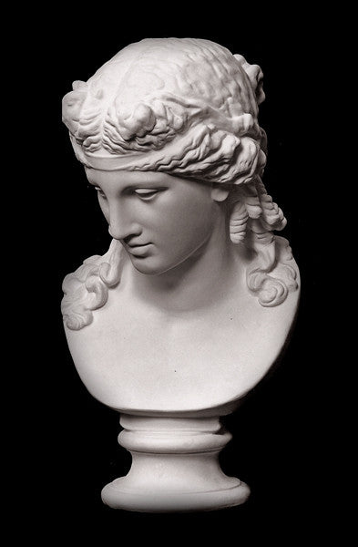photo of plaster cast of sculpture bust of Ariadne or Bacchus with long, curly hair and head band on a black background