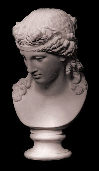 photo of plaster cast of sculpture bust of Ariadne or Bacchus with long, curly hair and head band on a black background