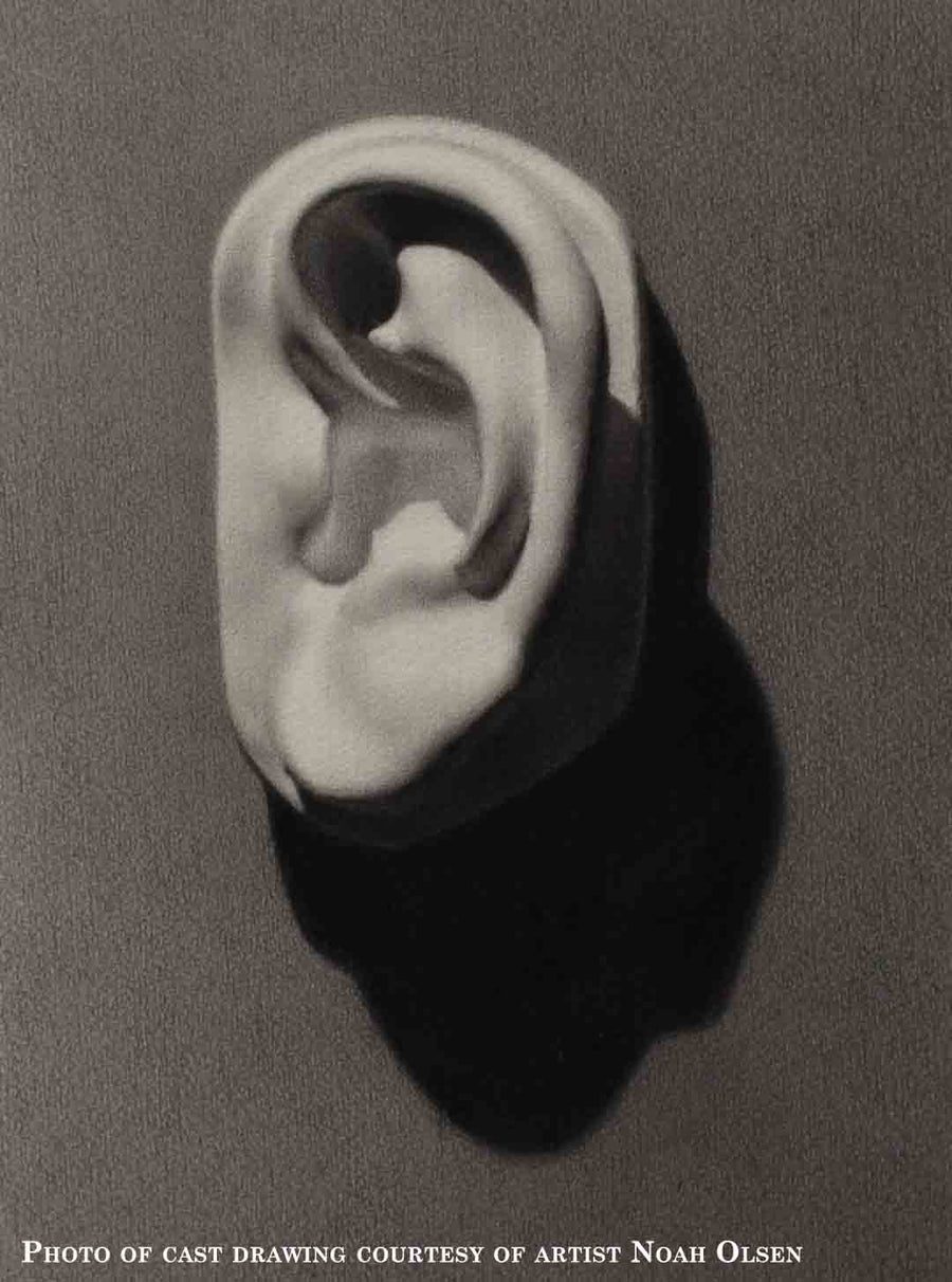 photo of cast sculpture drawing of left ear from Michelangelo's David statue against a gray background