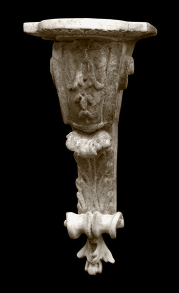 Photo of plaster sculptural ornament from the Renaissance on a black background