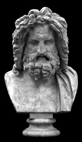 Photo of plaster cast sculpture of male bust, namely the god Zeus, with curly hair and beard and robe on left shoulder with a black background
