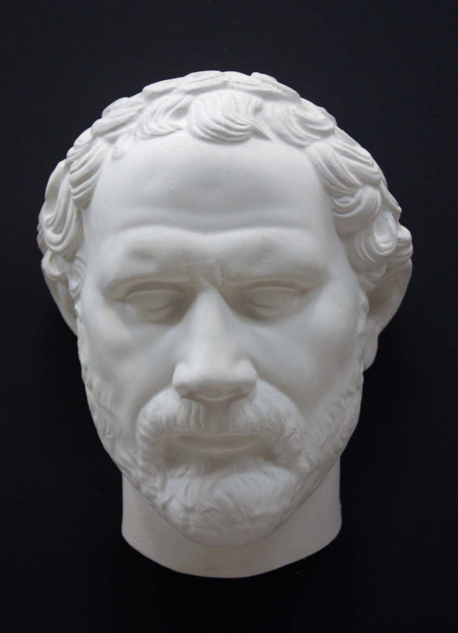 photo of white plaster cast of sculpture of face of Demosthenes with curly hair and beard on black background