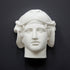 photo of white plaster cast mask of ancient sculpture of head, namely Omphale or Hercules, wearing Nemean lion skin against dark gray background