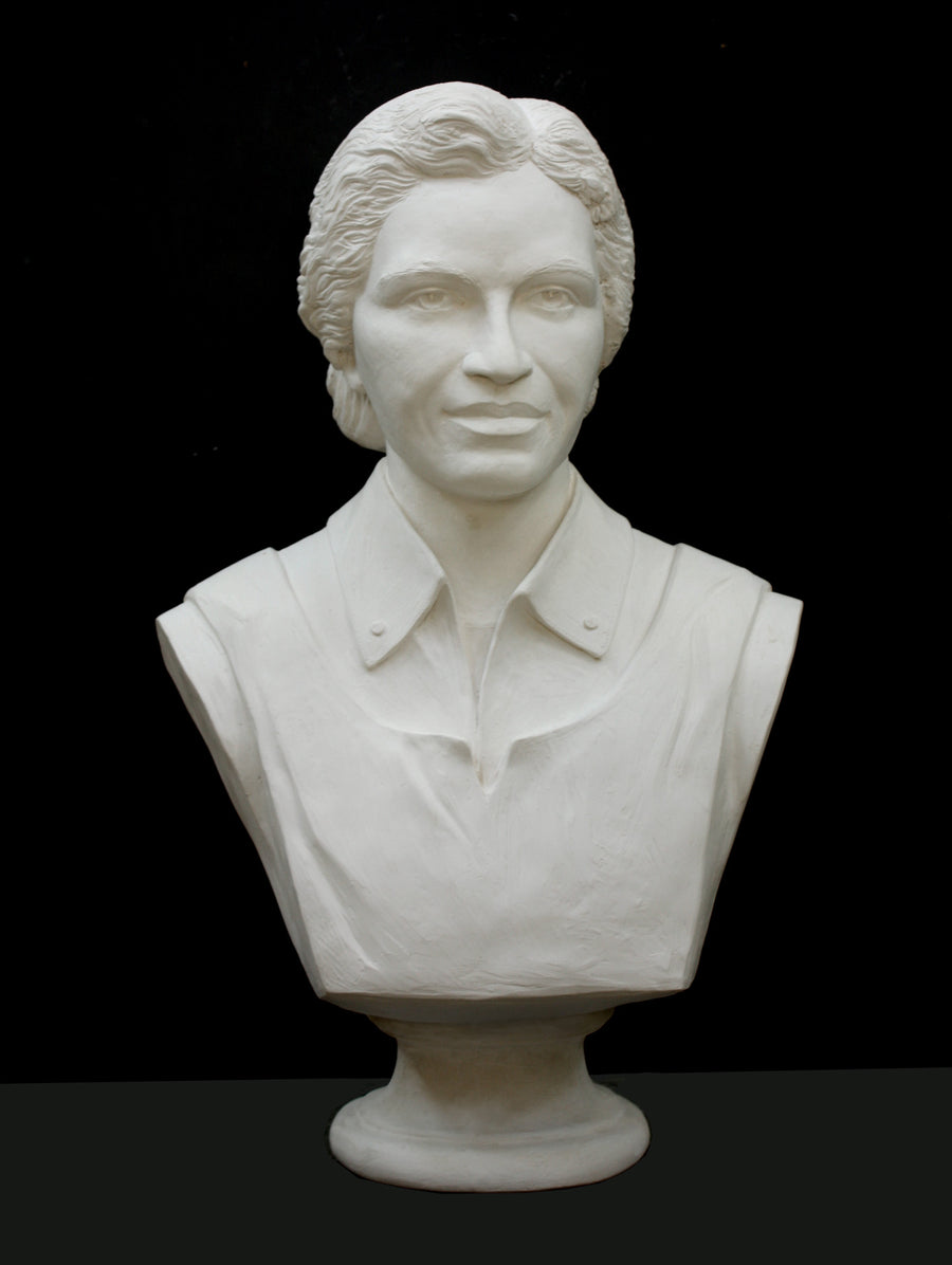 Photo of plaster cast of sculpture bust of Rosa Parks on a black background