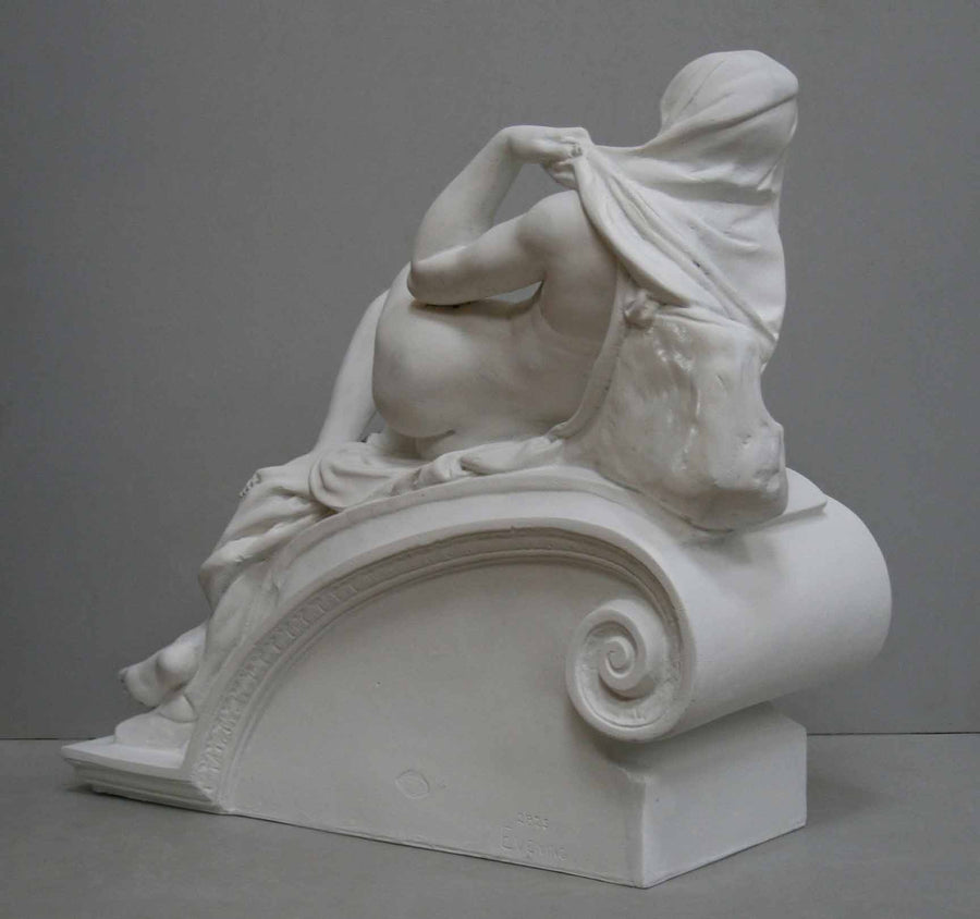 back view photo of plaster cast of reclining female nude with a gray background