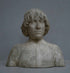 photo of plaster cast bust of man with high-neck shirt and shoulder-length hair with gray background