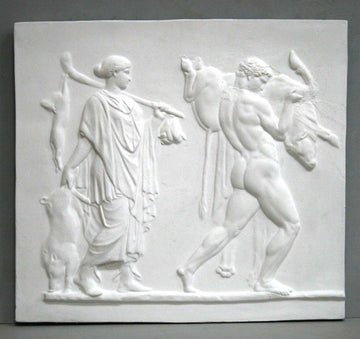 photo of plaster cast sculpture relief with two figures walking towards the right, the male, Hercules, carrying a boar, and the female carrying 