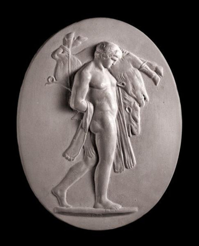 Image of a small plaster plaque of Hercules carrying a boar on a black background