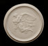 photo of plaster cast relief of woman with wings flying with two children nestled against her and an owl flying on a dark background