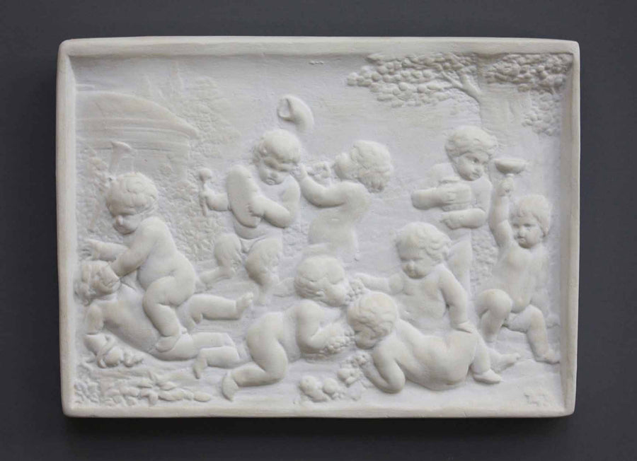 photo of plaster cast relief of one satyr and eight children wrestling and playing instruments with trees and domed building in the background on a gray background
