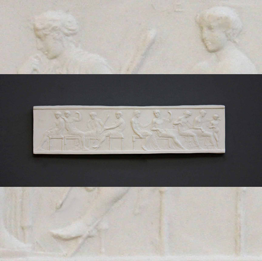 photo of plaster cast of small ancient relief with figures with a background of the same image zoomed-in