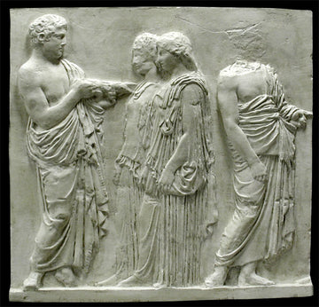 photo of off-white plaster cast relief sculpture of two robed men and two robed women from Parthenon against black background