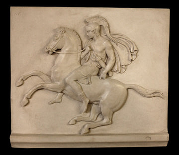 Photo of plaster cast sculpture relief of man with helmet and drapery on a rearing horse
