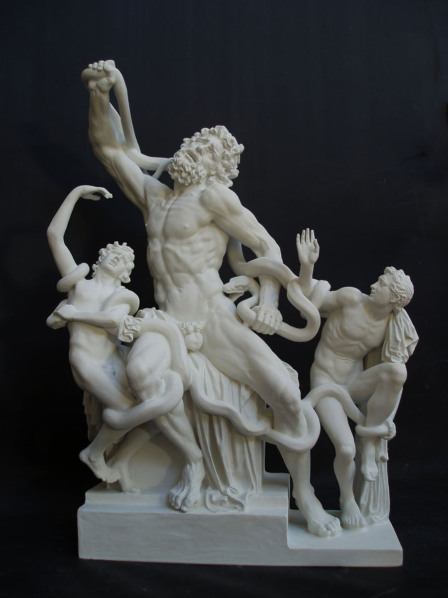 photo with black background of plaster cast sculpture of partially nude male figure, namely Laocoon, and two nude young men being attacked by serpents which twist in and out of the three figures