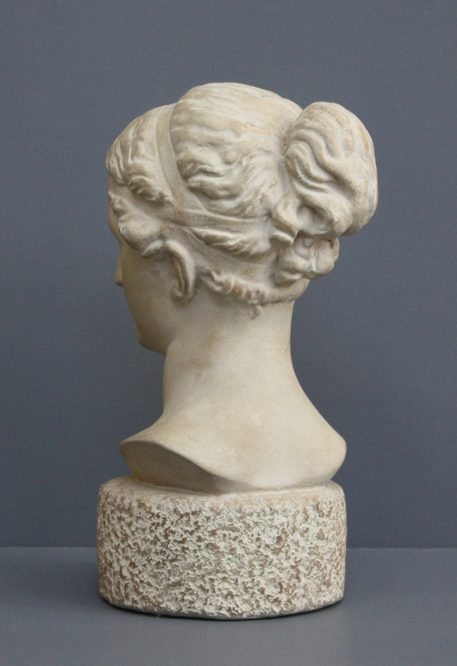 Photo of Plaster Cast sculpture bust of goddess Hebe on a gray background