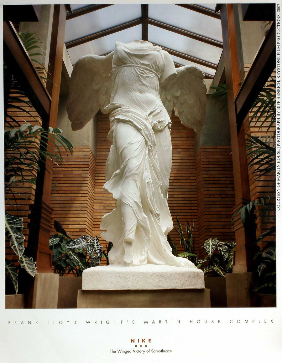 Martin House poster of plaster cast sculpture of winged, headless female figure with flowing drapery on a platform in a conservatory with glass ceiling, brick and stone walls, and plants